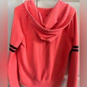 Pink Victoria’s Secret peach zip up hoodie.